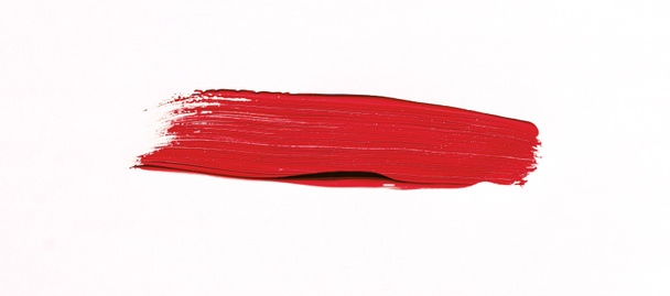 Rode penseelstreek geïsoleerd op witte achtergrond - Foto, afbeelding