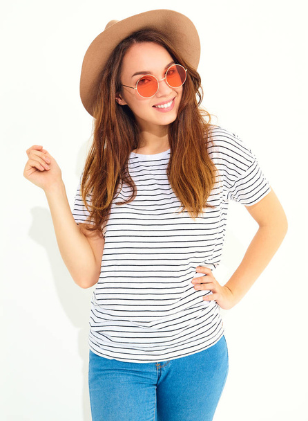 Portrait of young stylish laughing girl model in casual summer clothes in brown hat with natural makeup isolated on white background. In sunglasses - Φωτογραφία, εικόνα