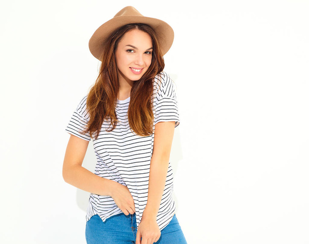Portrait of young stylish girl model in casual summer clothes in brown hat with natural makeup isolated on white background - Foto, afbeelding