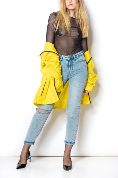 cropped shot of young woman in transparent shirt and yellow jacket on white - Photo, Image
