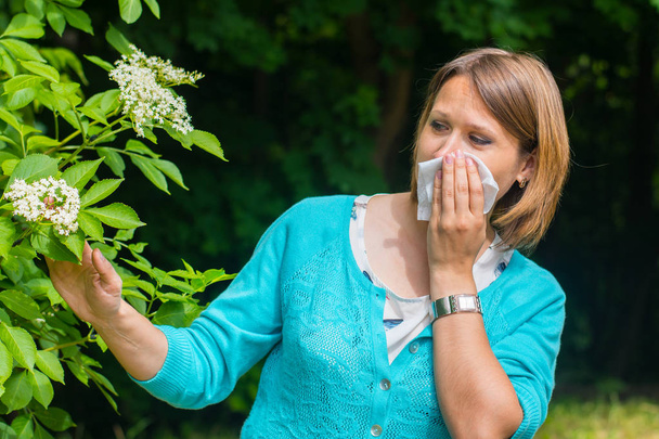 young woman outdoors. Allergy to pollen - Photo, Image