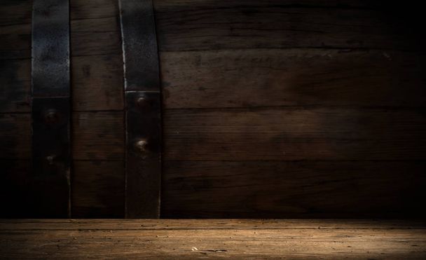 background of barrel and worn old table of wood. - 写真・画像