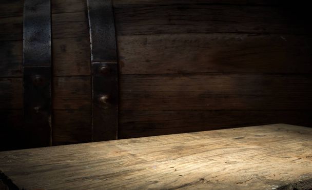 background of barrel and worn old table of wood. - 写真・画像