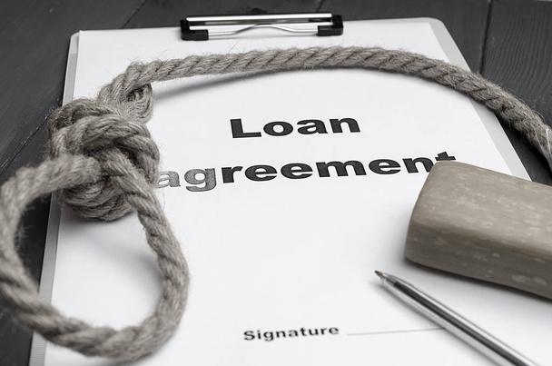 The concept of lending and the severity of loan repayment. Loan agreement, a loop, soap, a pen. - Photo, Image