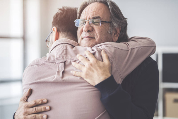Son hugs his own father - Photo, image