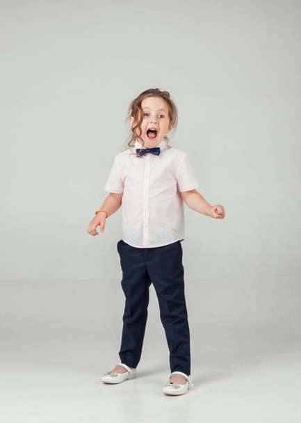 the child in the Studio posing in fashionable clothes - 写真・画像