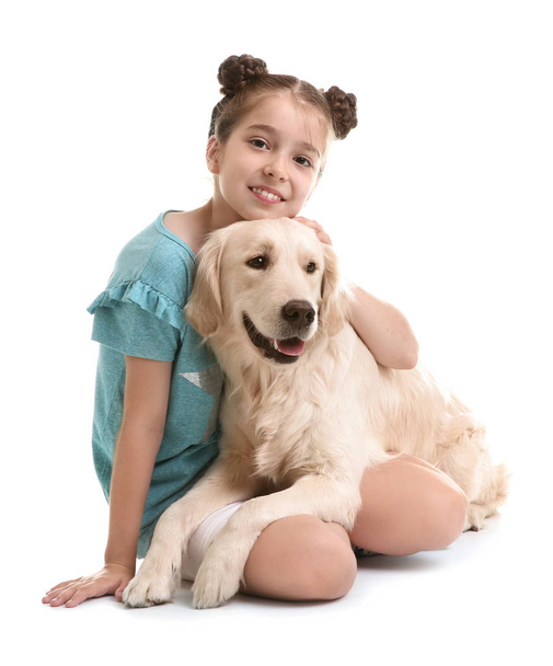 Cute little child with her pet on white background - Foto, immagini