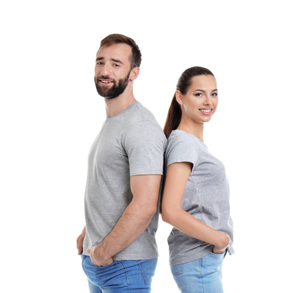 Young couple in t-shirts on white background. Mockup for design - Photo, Image