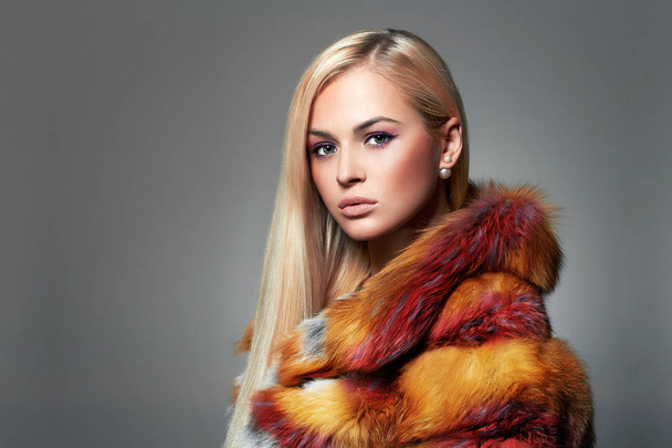 Beautiful Blond Girl in colorful Fur. Winter Style Woman in Luxury Fur. Rainbow, Make-up - Photo, Image