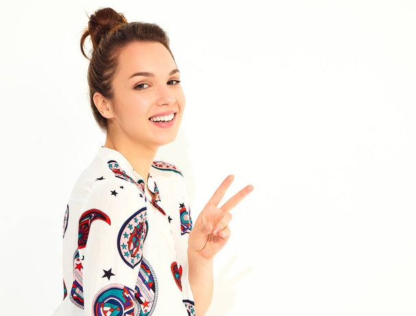 Smiling girl model in casual summer clothes, showing peace sign - Фото, изображение