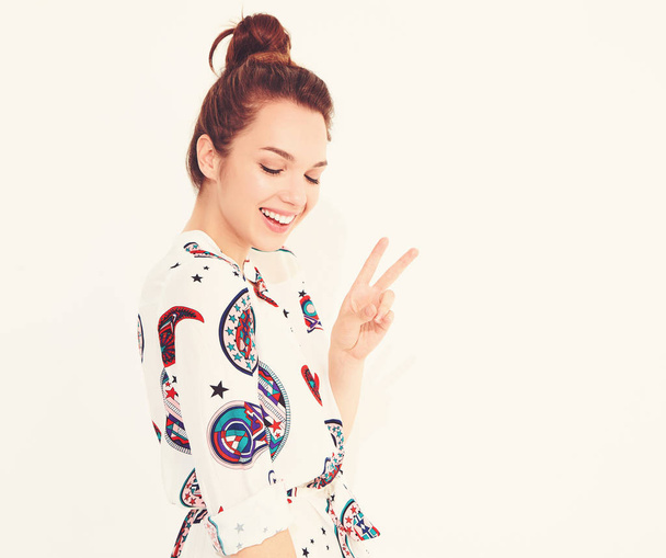 Smiling girl model in casual summer clothes, showing peace sign - Photo, Image