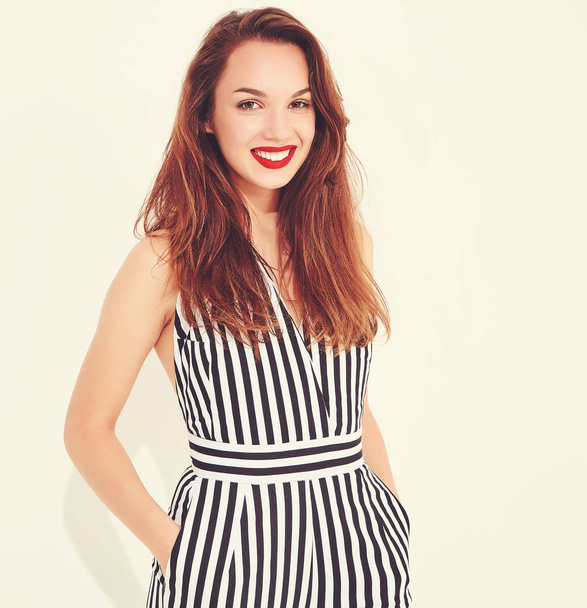 Young stylish smiling girl model in casual summer striped suit with red lips, isolated - 写真・画像