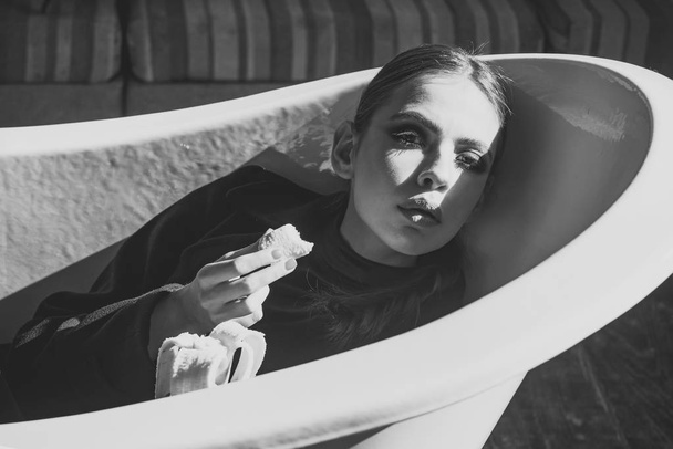 Cosmetology, beauty, visage. Girl with makeup on face in bath - Valokuva, kuva