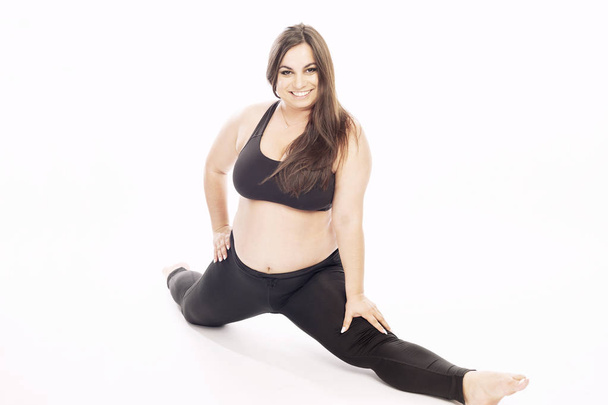 Young fat woman doing aerobic exercise - Zdjęcie, obraz