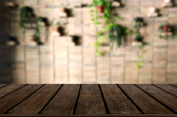 Selected focus empty brown wooden table and Coffee shop or restaurant blur background with bokeh image. for your photomontage or product display. - Foto, immagini