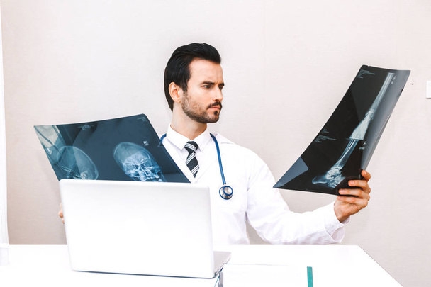 Doctor looking at x-ray photo  in hospital.healthcare and medicine - Photo, Image