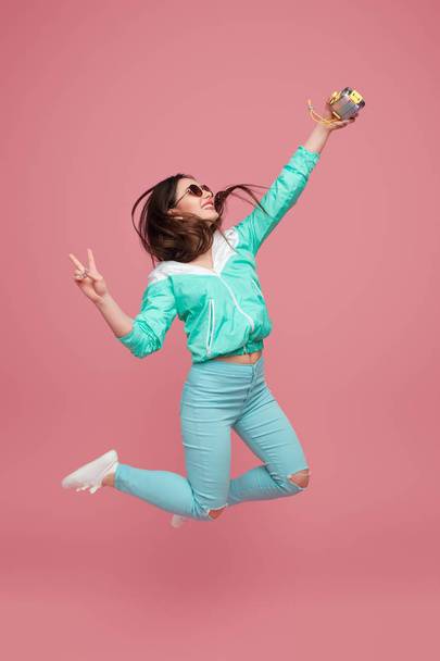 Woman jumping and taking selfie - Zdjęcie, obraz