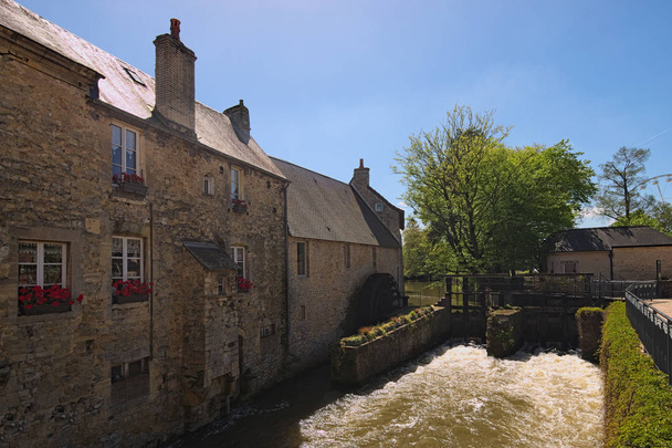 Water mill and Aure River in the old city in Bayeux. Calvados department of Normandy, France. - Photo, Image