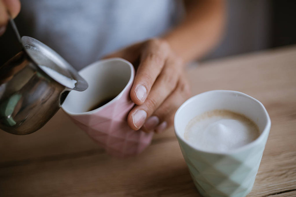 Pouring Milk In A Coffee Cup - Фото, зображення