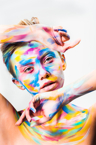 beautiful girl with colorful bright body art looking at camera isolated on white  - Foto, afbeelding