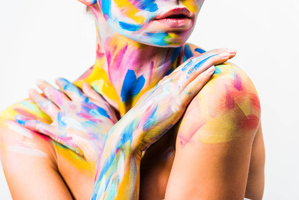 cropped image of girl with colorful bright body art touching shoulders isolated on white  - Photo, Image