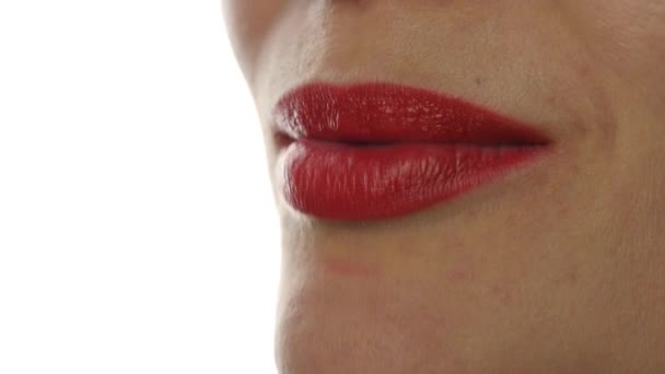 Extreme close up of sexy lip. Woman pursing her lips in a sexy seductive gesture. 4K - Materiał filmowy, wideo
