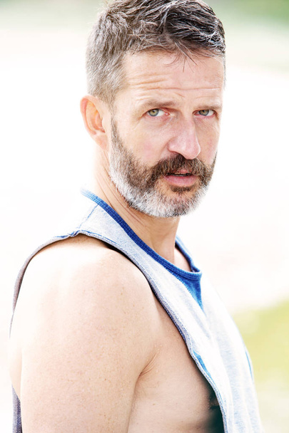 bearded handsome muscular athlete standing outdoors - Valokuva, kuva