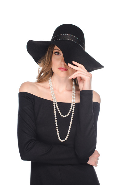 elegant female model in black straw posing isolated on white background  - Fotoğraf, Görsel