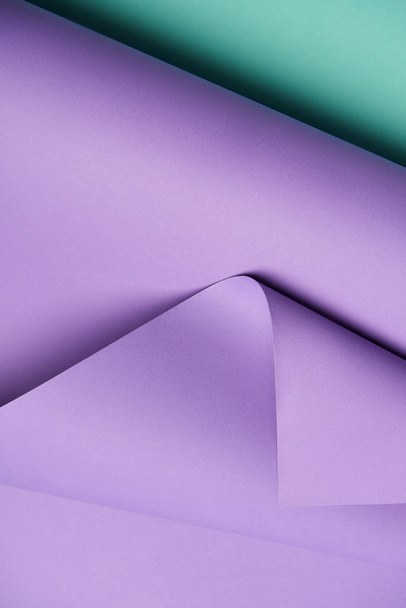 close-up view of beautiful violet and turquoise abstract paper background  - Foto, immagini