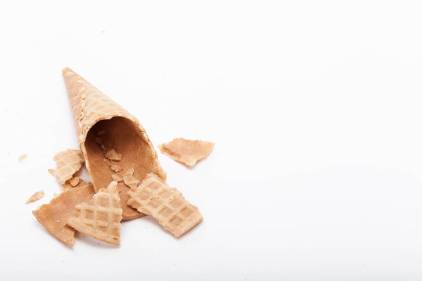 Broken empty sugar waffle cones on white background. - Photo, Image