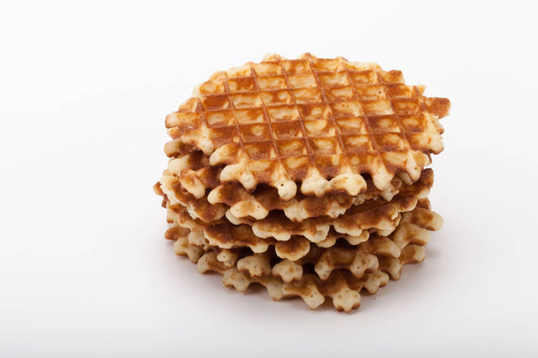 Stack of round waffles on white background - Foto, afbeelding
