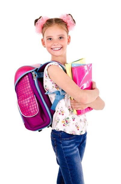 Portrait of smiling happy school girl child with school bag backpack and books isolated on a white background education concept - Foto, Imagem