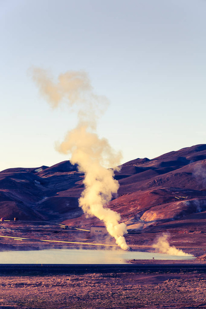 Steam from thermal springs in the desert landscape of Iceland. Toned. - Zdjęcie, obraz