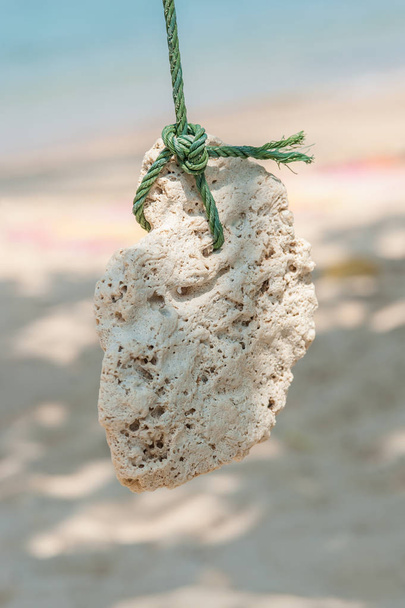 Beautiful vintage sea sponge hanging on the rope. Close up - Foto, Imagen