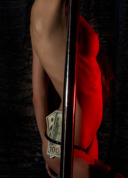 sexy ass in underwear with money tucked in her panties. nightclub striptease dancer - Фото, изображение