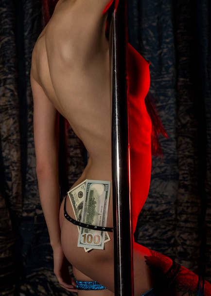 sexy ass in underwear with money tucked in her panties. nightclub striptease dancer - Fotó, kép