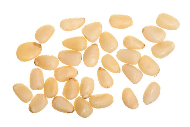 Shelled cedar pine nuts isolated on white background. Top view. Flat lay - Photo, image