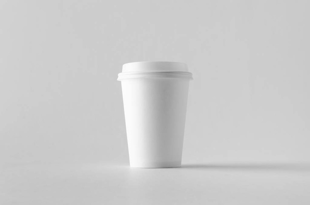 12 oz. white coffee paper cup mock-up with lid. - 写真・画像