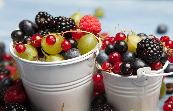 Various fresh summer berries. Top view. Berries mix fruit color food dessertBerries.Antioxidants, detox diet, organic fruits. - Фото, изображение