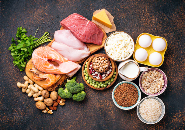 Healthy food high in protein. Meat, fish, dairy products, nuts and beans. Top view - Photo, Image