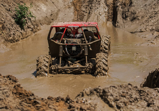 Detail of buggy stuck in mud outdoor - Photo, Image