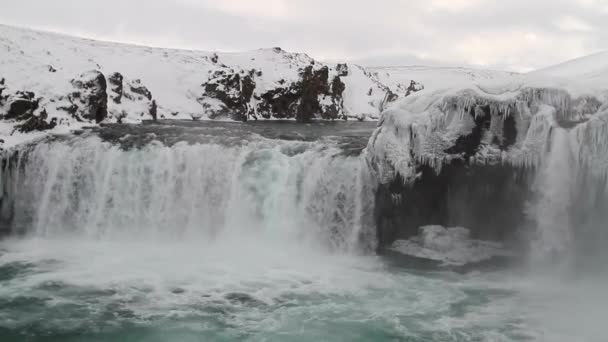 Godafoss, One of the most famous waterfalls in Iceland. Godafoss covered in snow and ice. Godafoss, or the "Waterfall of the Gods", one of Iceland's most beautiful waterfalls in winter. - Footage, Video