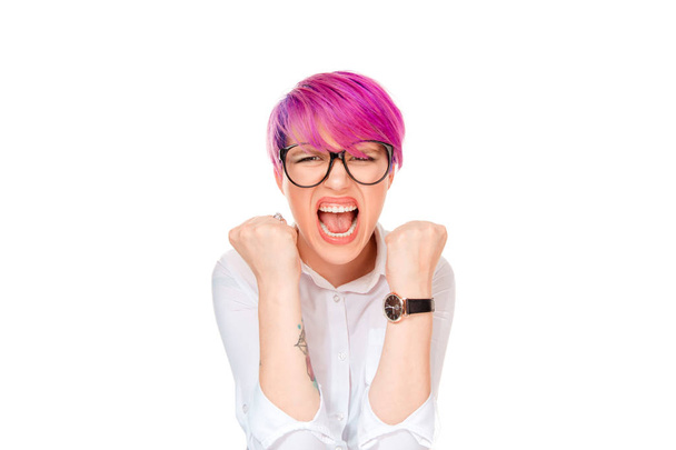 Portrait angry young woman with eyeglasses screaming yelling fists clenched. Pink magenta hairstyle girl isolated over white background. Mixed race latin hispanic caucasian millennial fashion model - Φωτογραφία, εικόνα