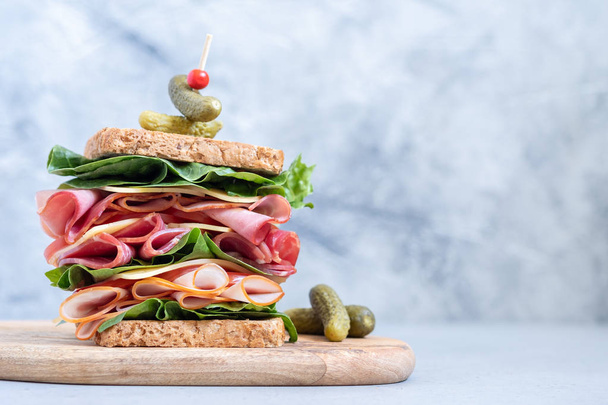 Big sandwich stack with ham, deli meat, cheese and vegetables - Foto, Imagen