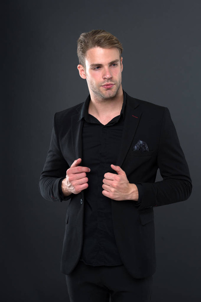 Confident in every detail. Man well groomed elegant black formal suit handkerchief pocket dark background. Macho confident perfect outfit. Guy office worker handsome perfect confident appearance - Fotografie, Obrázek