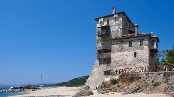 Medieval tower at the beach of town of Ouranopoli, Athos, Chalkidiki, Central Macedonia, Greece  - Photo, Image