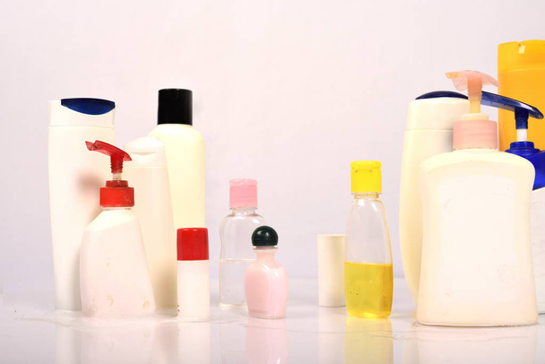 Many white plastic bottles on white background.  - Photo, Image