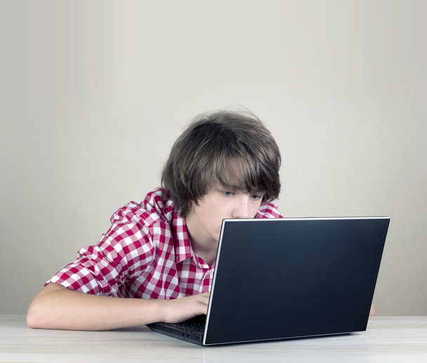 Boy working playing on laptop computer - Photo, Image