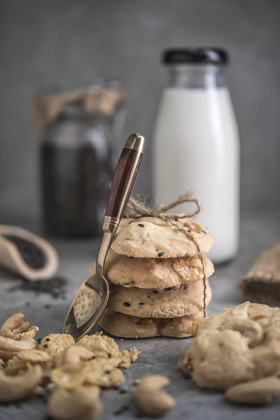 Close view of freshly baked cashew nuts cookies on rustic wooden table - Fotografie, Obrázek