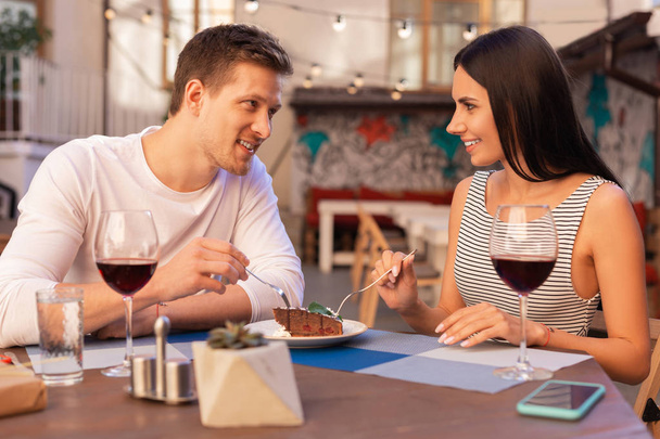 Smiling woman eating sweet dessert with her loving man - Foto, Imagem